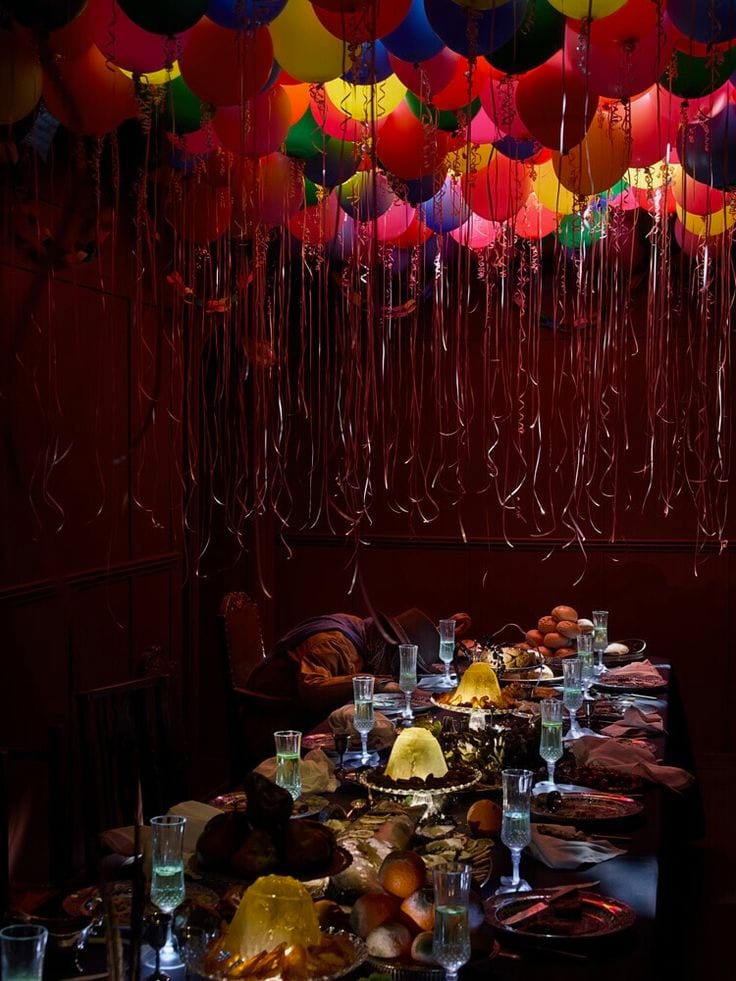 A banquet table beneath a canopy of colour