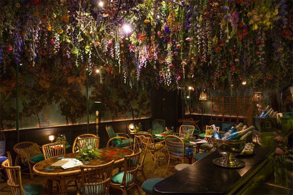 A conservatory bar under hanging florals
